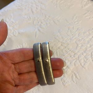 2 silver tone stretch bracelets.